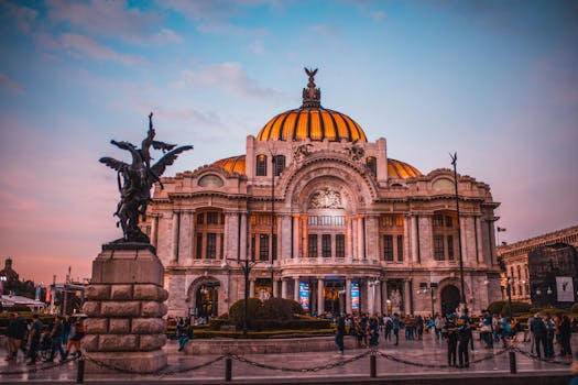 pexels-photo-604661-604661 Vibrant sunset at the historic Palacio de Bellas Artes in Mexico City, bustling with tourists.